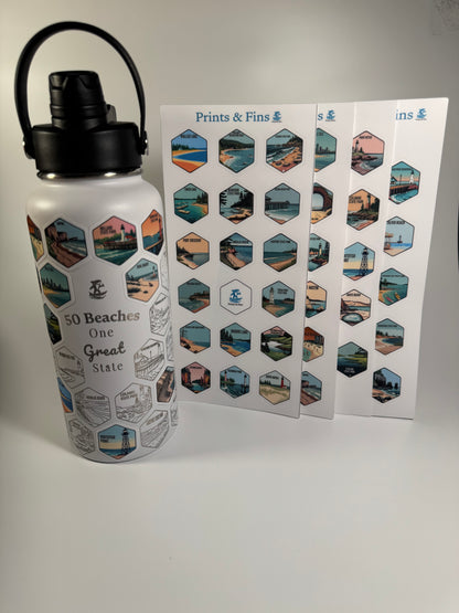 A white insulated water bottle with a black lid and carry loop, printed with beach scene hexagons and the text '50 Beaches One Great State,' shown beside two printed sheets of matching hexagonal beach prints.